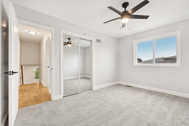 310 Muskegon Ave, Calumet City, IL 60409 - unfurnished bedroom with ceiling fan, visible vents, carpet floors, baseboards, and a closet