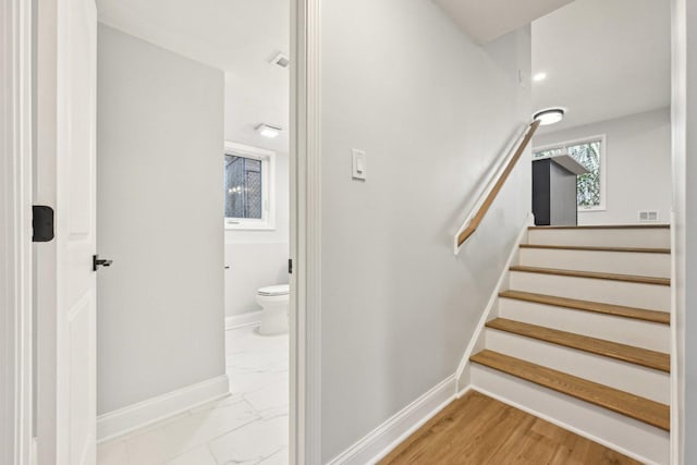 310 Muskegon Ave, Calumet City, IL 60409 - stairway featuring baseboards, marble finish floor, and visible vents