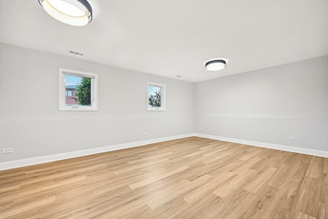 310 Muskegon Ave, Calumet City, IL 60409 - empty room featuring baseboards, light wood-type flooring, and visible vents