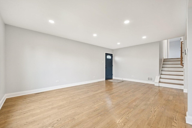 310 Muskegon Ave, Calumet City, IL 60409 - unfurnished living room with visible vents, recessed lighting, stairs, and light wood finished floors