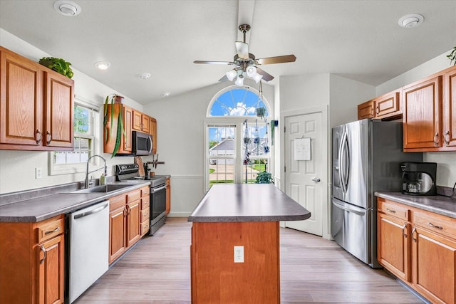 4022 Orchard Ln, Monticello, IL 61856 - kitchen featuring appliances with stainless steel finishes, a sink, lofted ceiling, a kitchen island, and ceiling fan