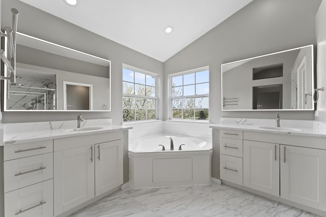 full bath with a shower stall, a sink, lofted ceiling, and a garden tub