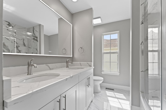 full bath featuring visible vents, a marble finish shower, a sink, and marble finish floor