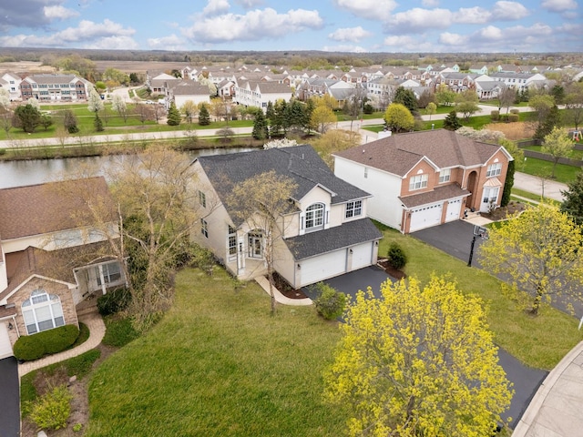 birds eye view of property with a residential view