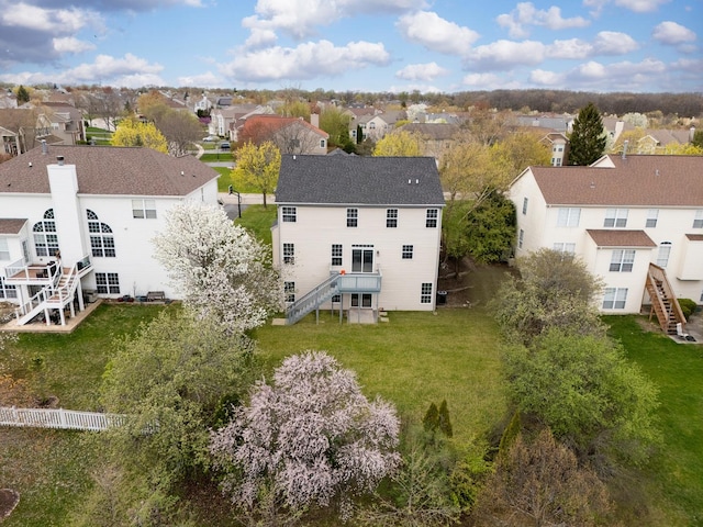 birds eye view of property with a residential view