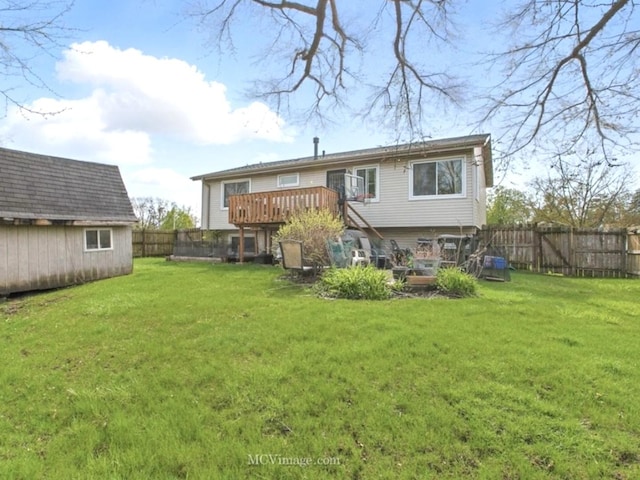 224 Lexington Dr, Bolingbrook, IL 60440 - back of property featuring a yard, a shed, an outbuilding, a fenced backyard, and a wooden deck