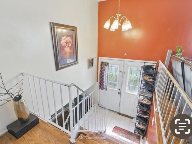 224 Lexington Dr, Bolingbrook, IL 60440 - foyer featuring a chandelier, a high ceiling, and french doors