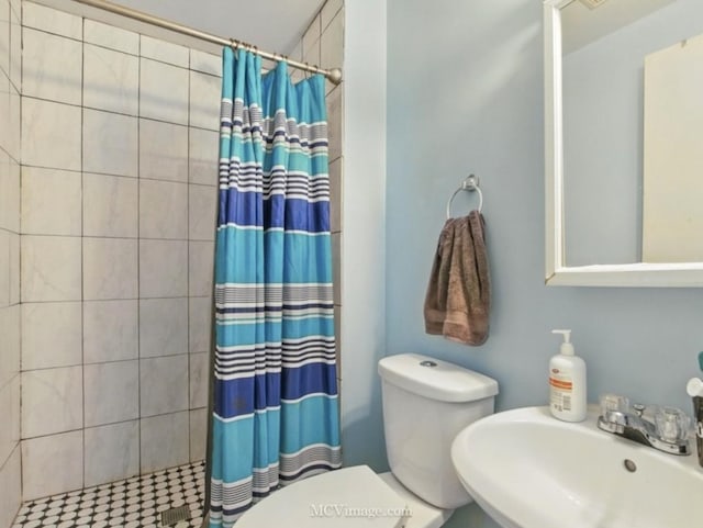 224 Lexington Dr, Bolingbrook, IL 60440 - full bathroom with a sink, toilet, and a tile shower