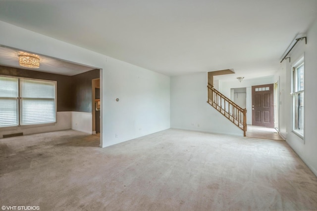 714 New Mexico Trl, Elk Grove Village, IL 60007 - unfurnished living room featuring carpet floors and stairs