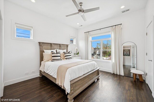 bedroom featuring dark wood-type flooring, baseboards, recessed lighting, and a ceiling fan