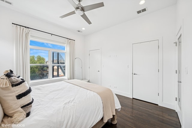 bedroom featuring wood finished floors, recessed lighting, a ceiling fan, and baseboards