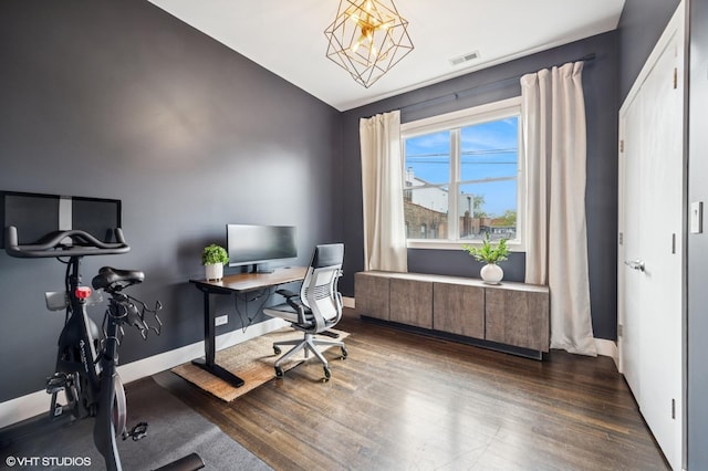 home office with wood finished floors, vaulted ceiling, a chandelier, and baseboards