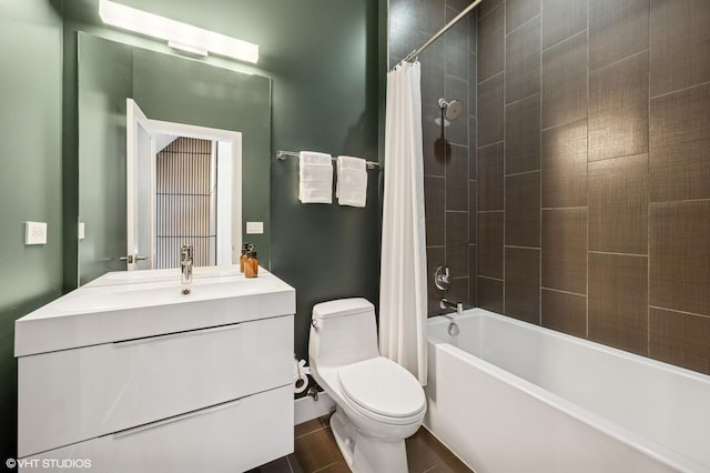 bathroom featuring toilet, shower / tub combo, and vanity