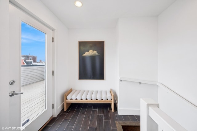 sitting room featuring dark wood-style flooring, baseboards, and recessed lighting