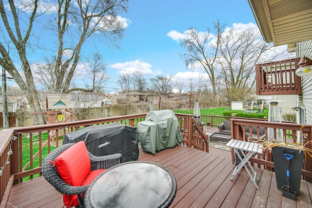 513 Wallace St, Chicago Heights, IL 60411 - wooden terrace featuring a playground, fence, and area for grilling