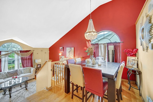 513 Wallace St, Chicago Heights, IL 60411 - dining space featuring an inviting chandelier, high vaulted ceiling, wood finished floors, and visible vents