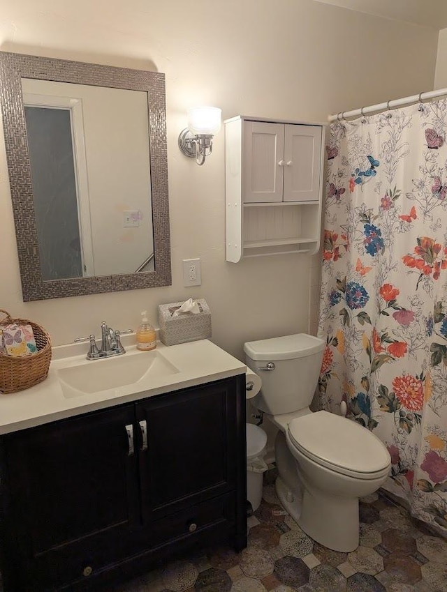 bathroom with vanity, a shower with curtain, and toilet