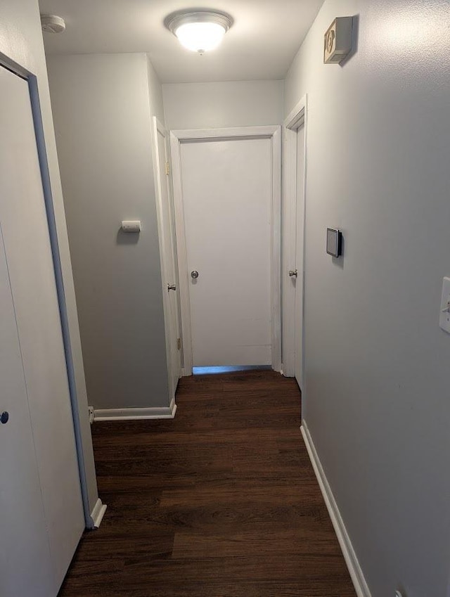 hall with wood finished floors