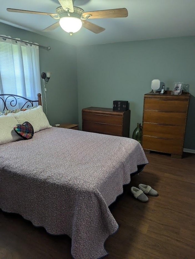 bedroom featuring ceiling fan and wood finished floors
