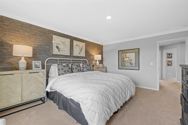 bedroom featuring crown molding, baseboards, and light colored carpet