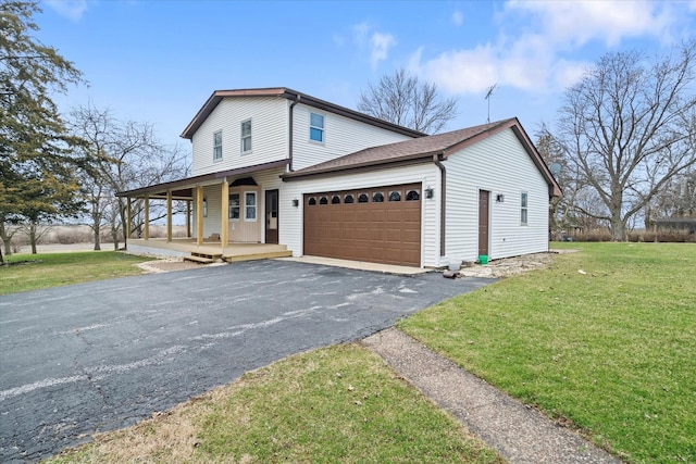 view of front of property featuring a garage, covered porch, a front yard, and aphalt driveway