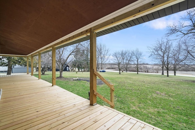 wooden terrace featuring a yard