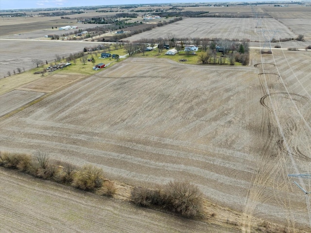 birds eye view of property with a rural view