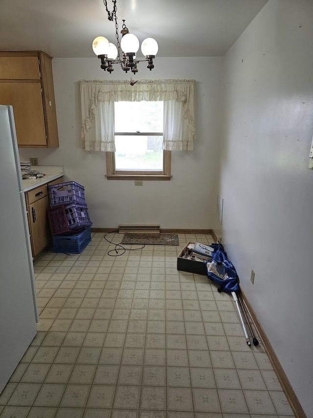 unfurnished dining area with baseboards and a notable chandelier