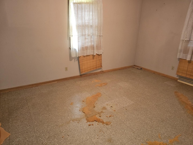 empty room with baseboards