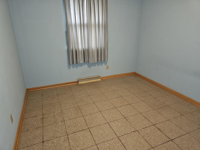 spare room featuring baseboards and visible vents