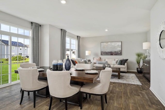 dining space with baseboards, recessed lighting, and dark wood finished floors