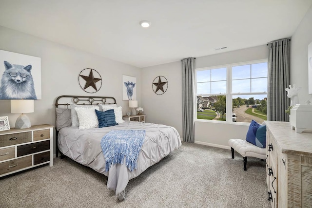 bedroom with visible vents, carpet, and baseboards