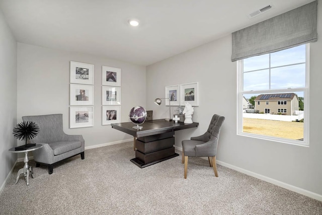office area with carpet floors, baseboards, and visible vents