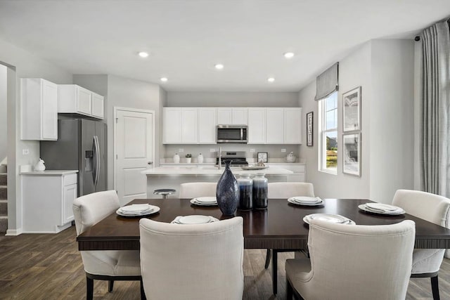 dining space with recessed lighting and dark wood-style floors