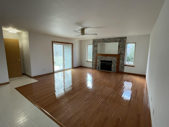 425 Tamarack St, Park Forest, IL 60466 - unfurnished living room featuring a fireplace, wood finished floors, and a ceiling fan
