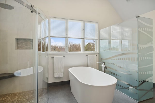 12 Forest Ln, South Barrington, IL 60010 - bathroom with a freestanding bath, lofted ceiling, and a stall shower