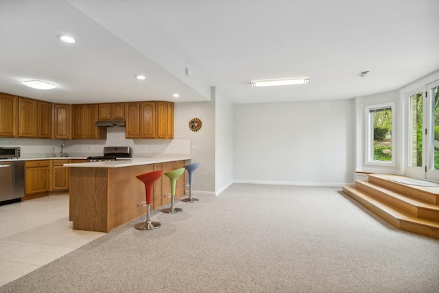 12 Forest Ln, South Barrington, IL 60010 - kitchen with a sink, brown cabinets, recessed lighting, and range