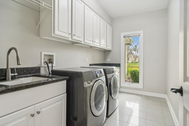 12 Forest Ln, South Barrington, IL 60010 - laundry room with cabinet space, light tile patterned flooring, a sink, baseboards, and washer and clothes dryer