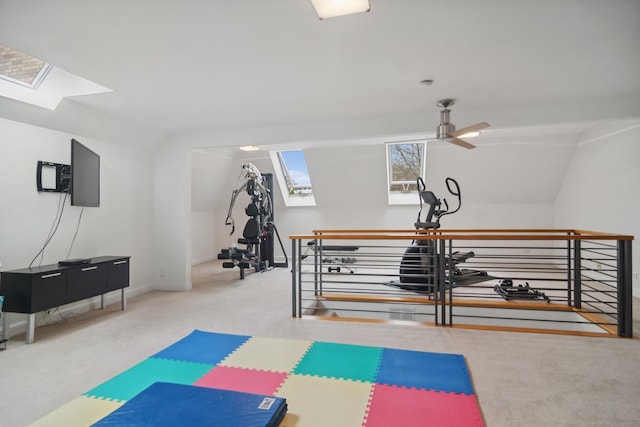 12 Forest Ln, South Barrington, IL 60010 - workout room featuring baseboards, carpet, lofted ceiling with skylight, and ceiling fan