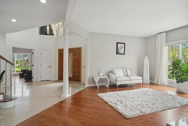 12 Forest Ln, South Barrington, IL 60010 - living room featuring light tile patterned floors, baseboards, decorative columns, and recessed lighting