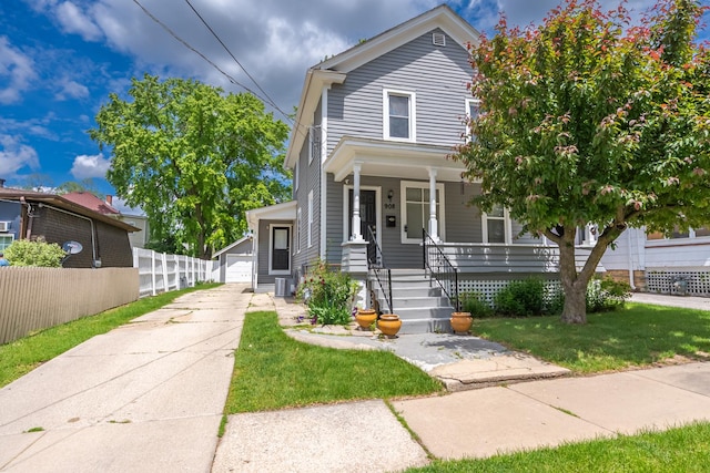 908 Superior St, Aurora, IL 60505 - traditional style home with covered porch, an outbuilding, central AC unit, and a detached garage