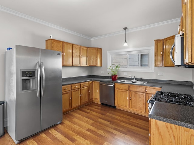 908 Superior St, Aurora, IL 60505 - kitchen with appliances with stainless steel finishes, a sink, crown molding, and dark countertops