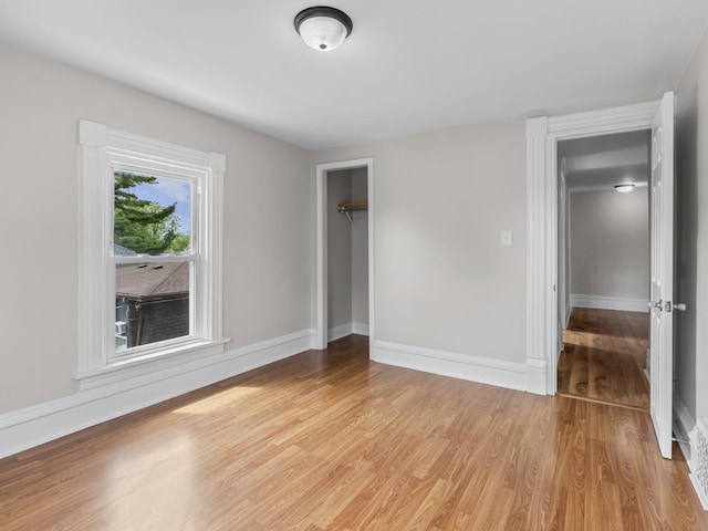 908 Superior St, Aurora, IL 60505 - unfurnished bedroom featuring light wood finished floors, baseboards, and a closet