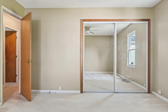 27 Arlington Dr, Romeoville, IL 60446 - unfurnished bedroom featuring carpet flooring, a closet, and baseboards