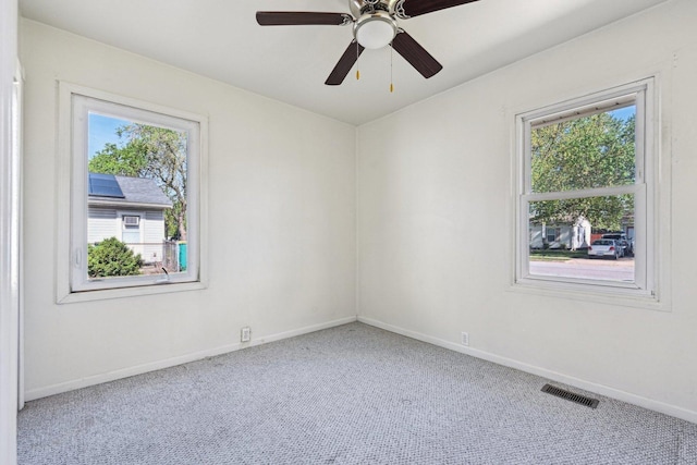 27 Arlington Dr, Romeoville, IL 60446 - unfurnished room with carpet, baseboards, and a ceiling fan