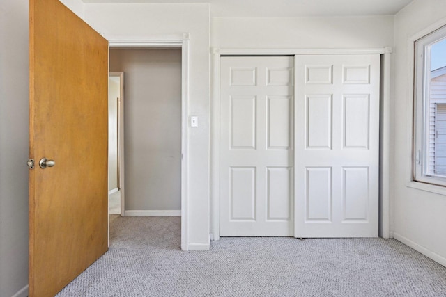 27 Arlington Dr, Romeoville, IL 60446 - unfurnished bedroom featuring carpet flooring, a closet, and baseboards