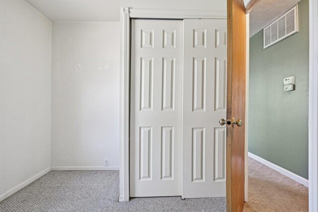 27 Arlington Dr, Romeoville, IL 60446 - unfurnished bedroom featuring carpet, a closet, and baseboards