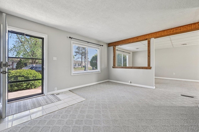 27 Arlington Dr, Romeoville, IL 60446 - carpeted empty room with baseboards and tile patterned flooring