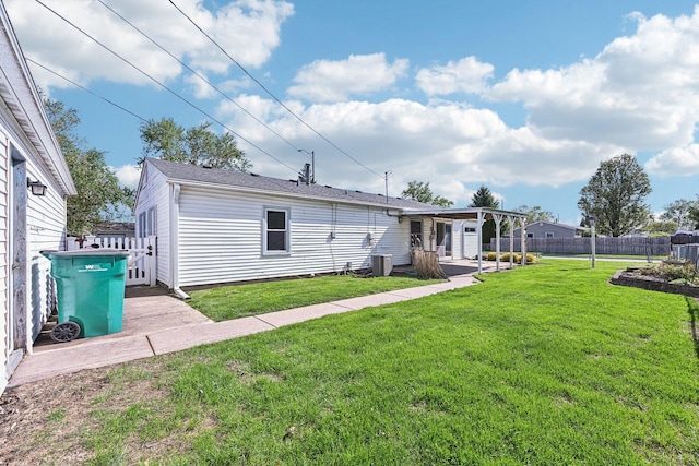 27 Arlington Dr, Romeoville, IL 60446 - back of property featuring central AC unit and a patio area