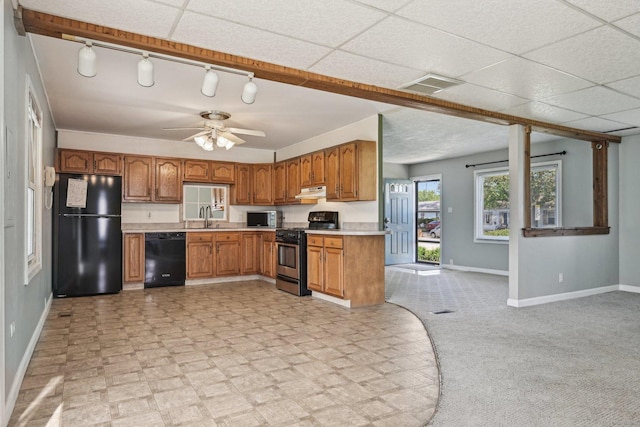 27 Arlington Dr, Romeoville, IL 60446 - kitchen with black appliances, a sink, baseboards, and light countertops